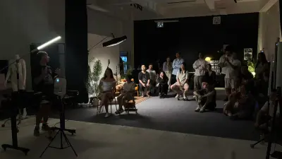Lemphek addressing the seated and standing audience at The A Frame.