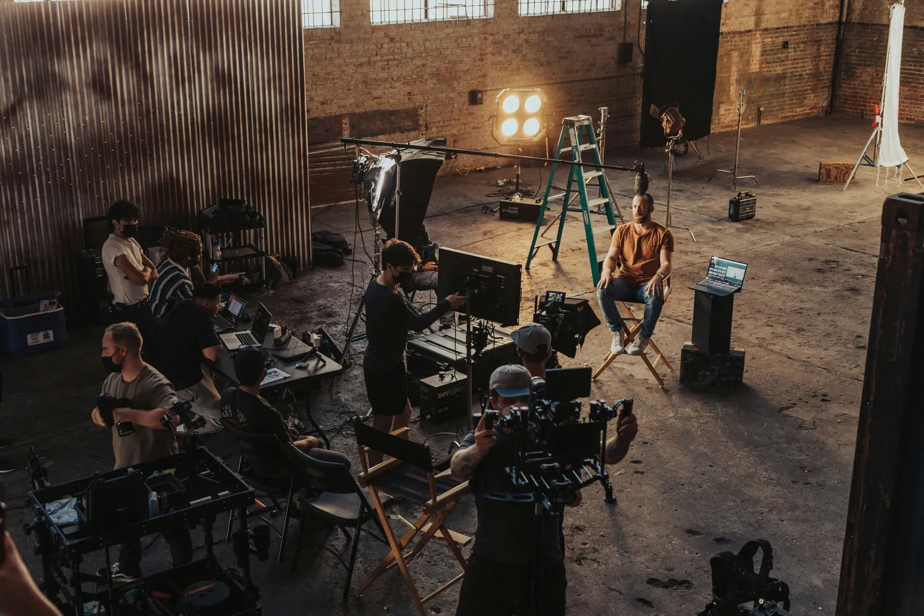 A film crew shaping a scene with camera, lighting, and sound on set