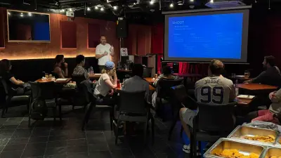 Tim Ramak and attendees at Flames in Shenzhen, with the buffet in the foreground.