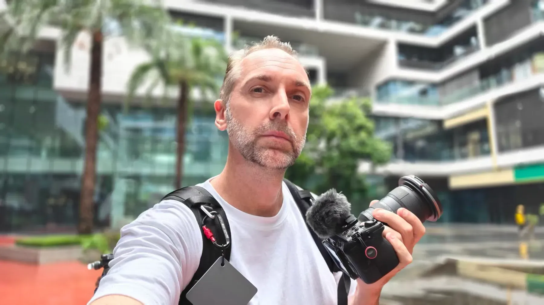 Filmmaker Tim Ramak holding his camera in Shenzhen
